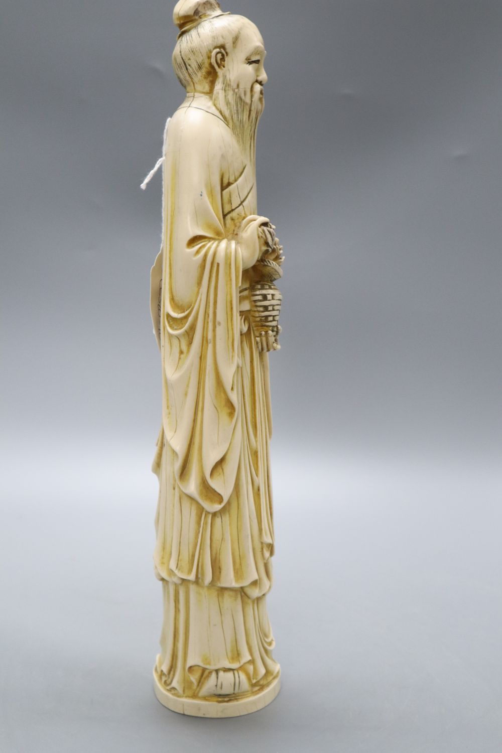 A Chinese simulated ivory figure of an elder, height 37cm